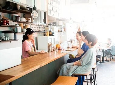 people-talking-to-a-server-behind-the-counter