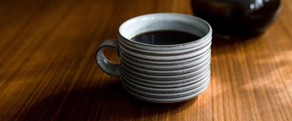 A freshly brewed cup of coffee on a table