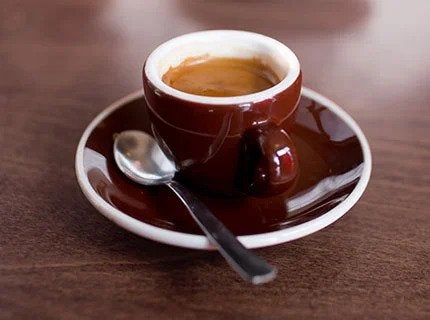 espresso in red cup and saucer