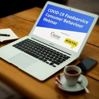 Open laptop displaying webinar details on screen