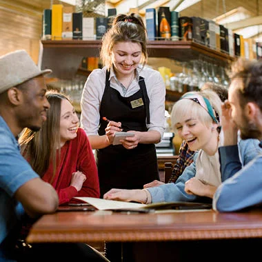 Customers ordering vegan restaurant dishes