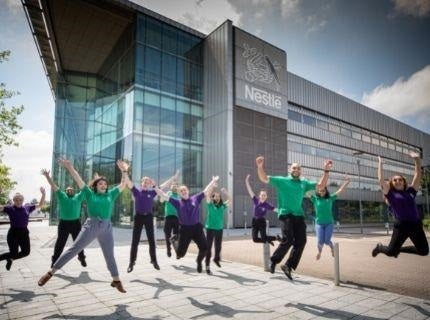 Group of Toque d'Or participants jumping in front of the UK Nestle building