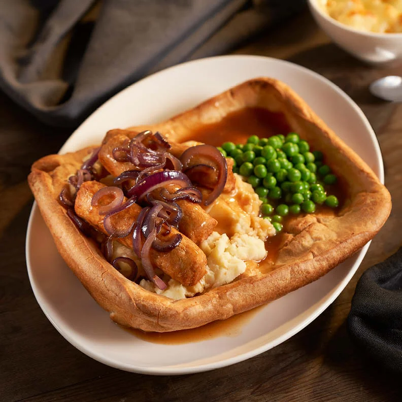 sausages on mash in a yorkshire pudding