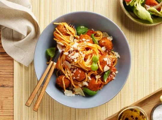Vegan pasta arrabbiata in a bowl at a restaurant