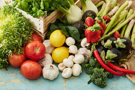 Group of vegetables, including tomatoes, garlic, aubergine and mushrooms