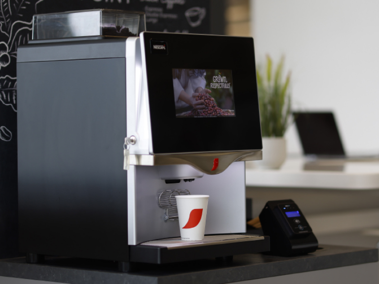 coffee machine with NESCAFÉ coffee cup
