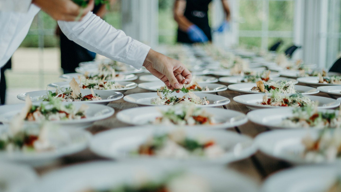 A chef plating food