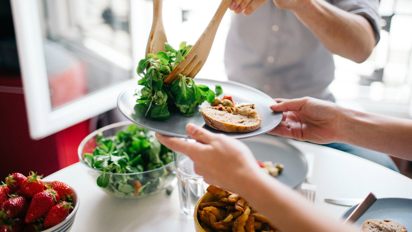 A person plating food
