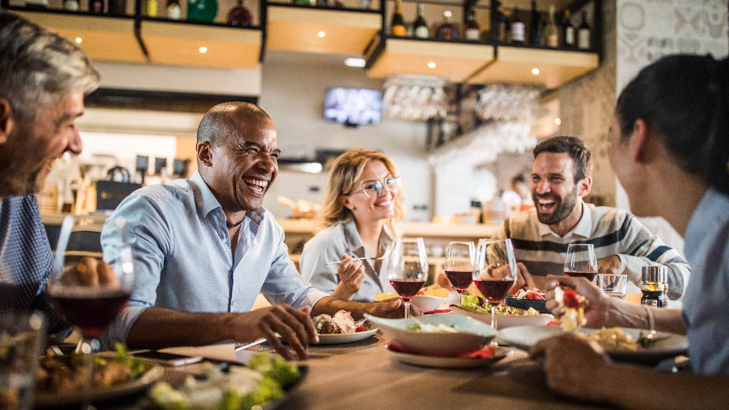 Friends laughing in a restaurant