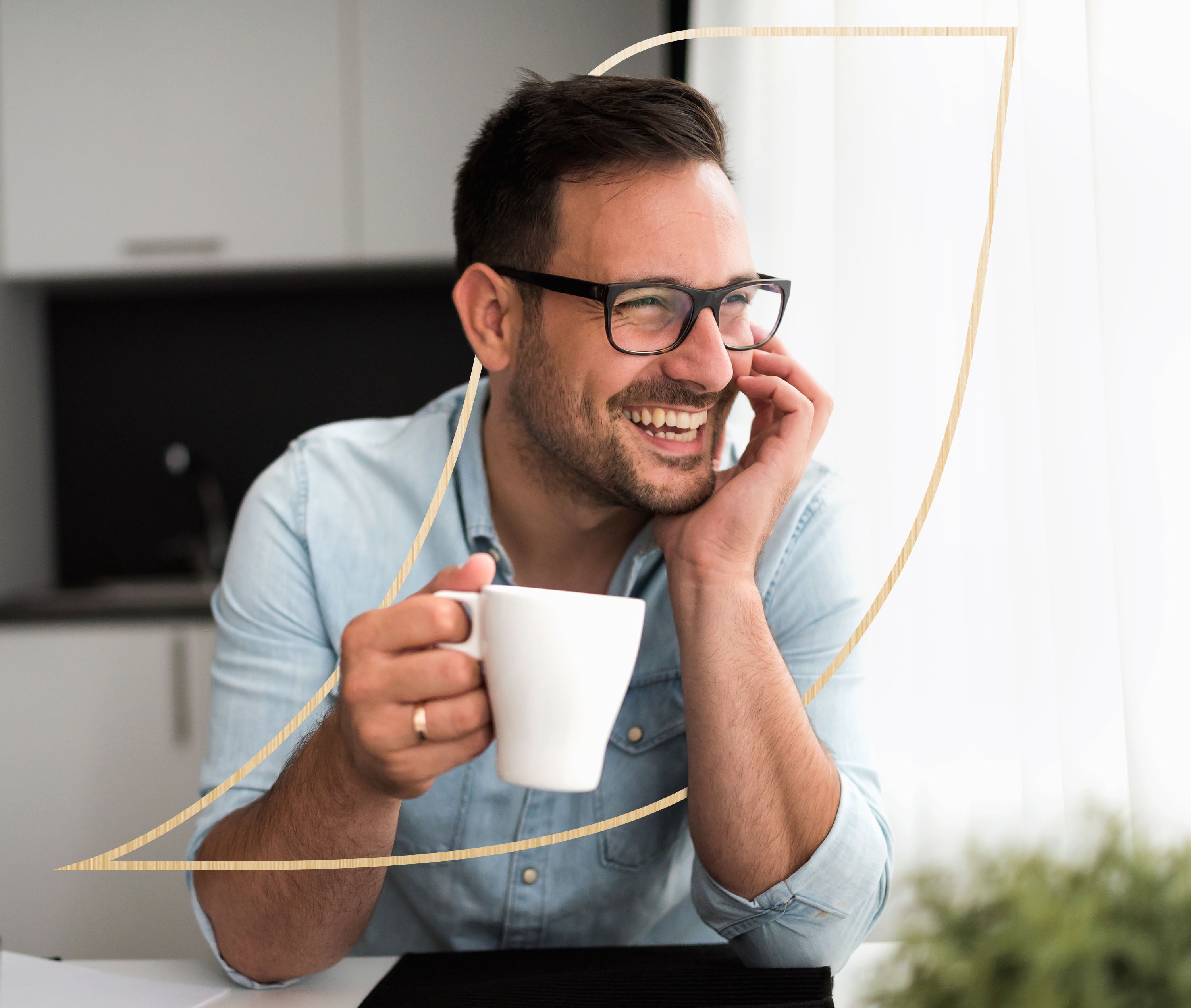 Male enjoying a cup of coffee with a smile