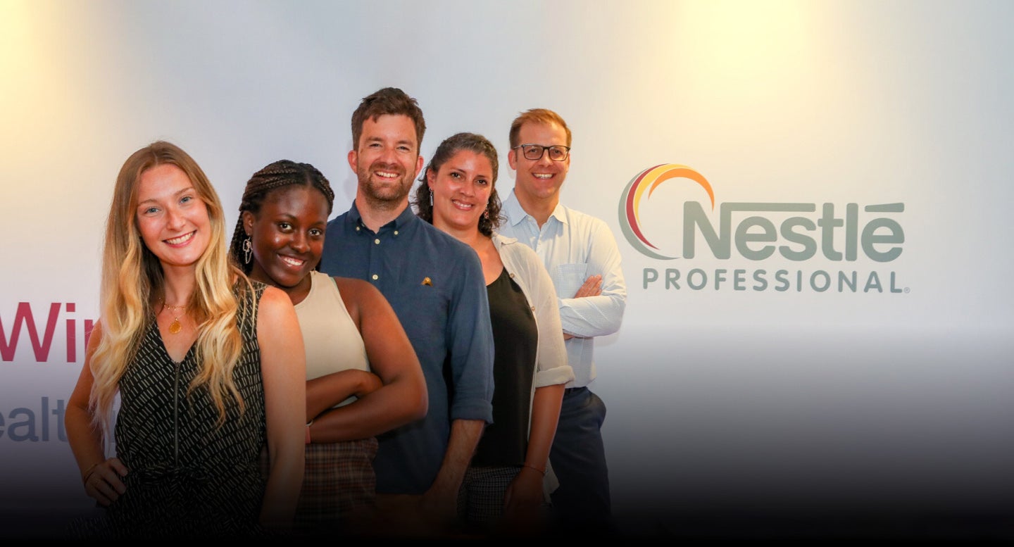 5 people standing together with the Nestle Professional logo
