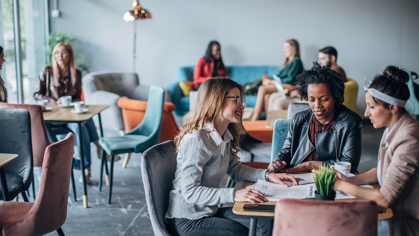 A group having a conversation in a cafe