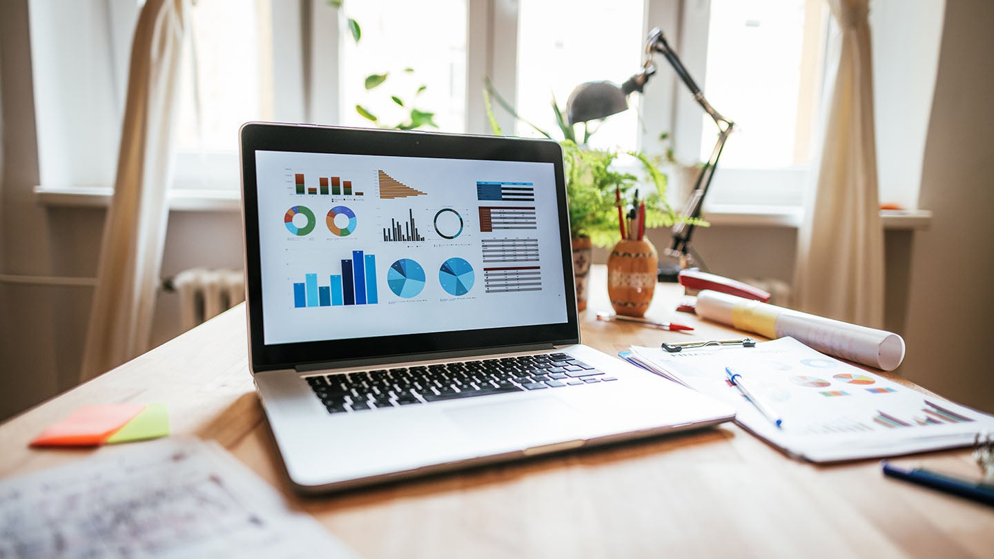 A laptop showing graphs