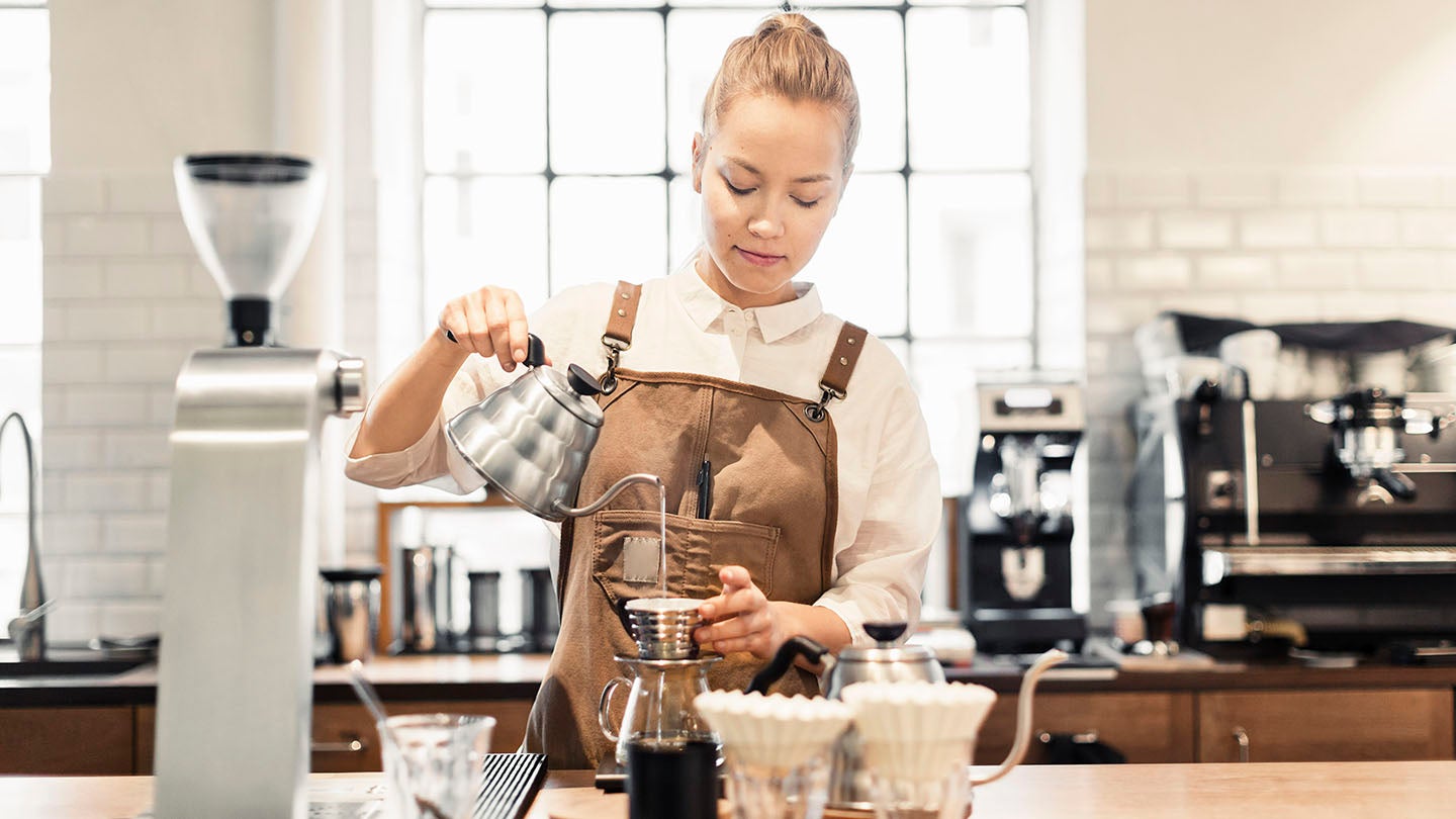 Woman making coffee
