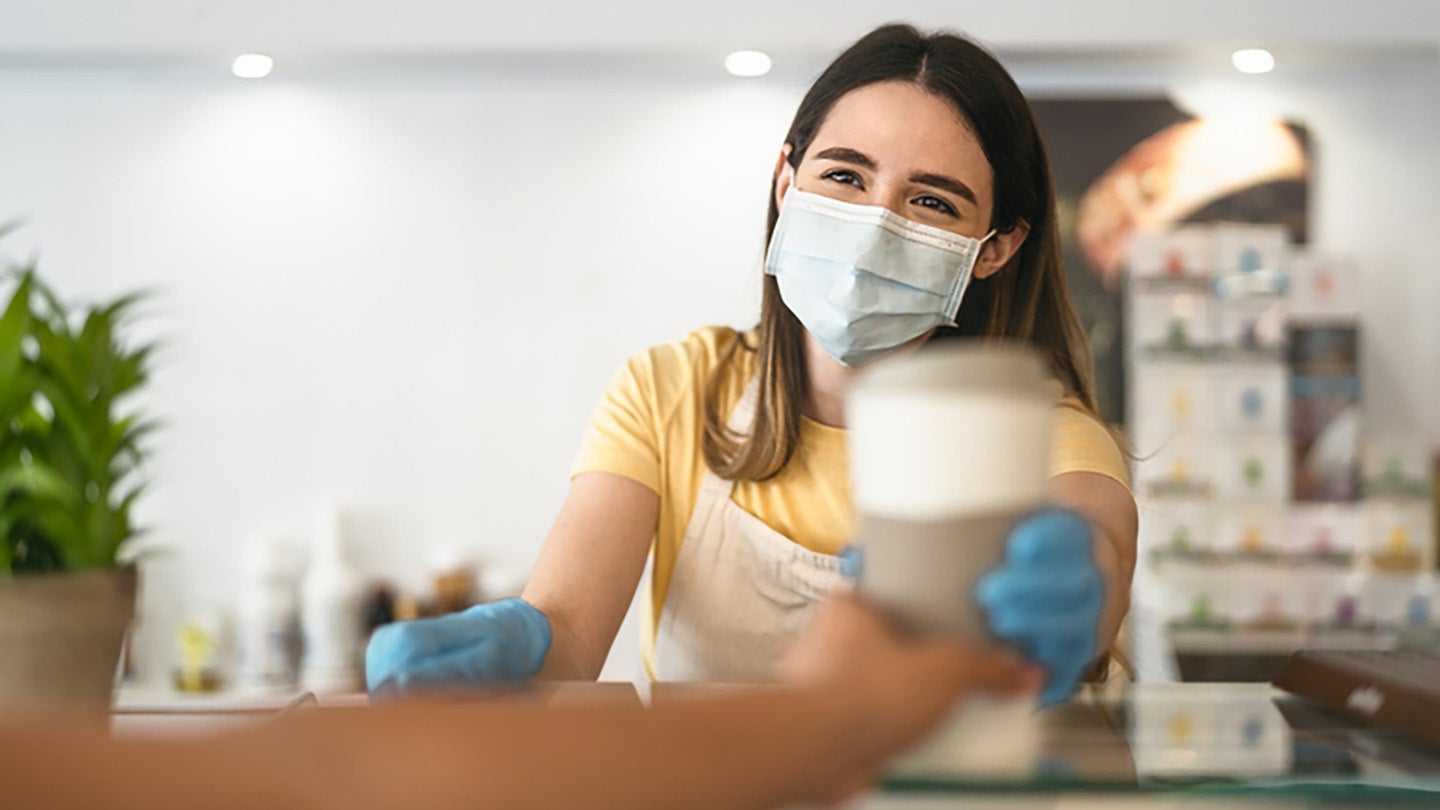 Barista serving a coffee