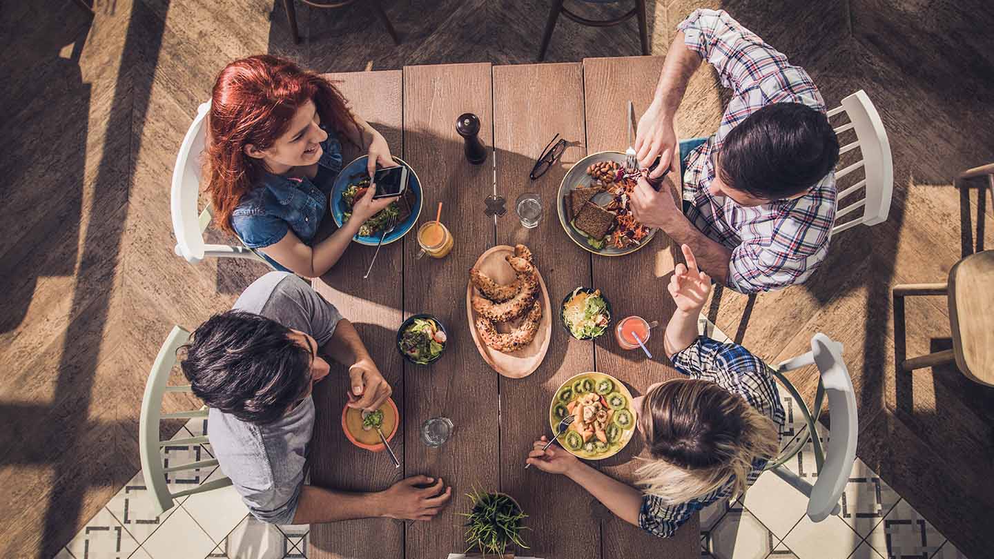 a view from above of friends having a meal