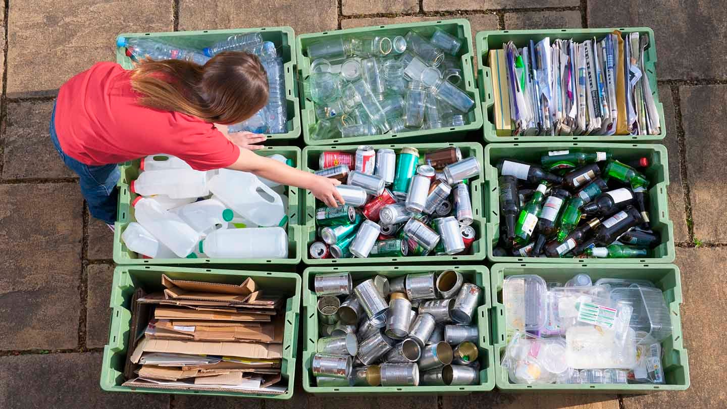 A person sorting through recycling