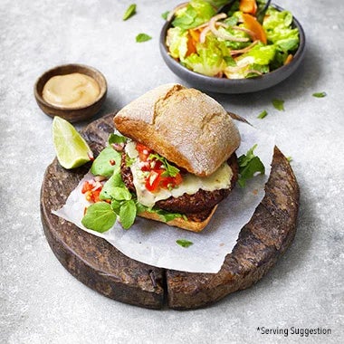 garden-gourmet-burger-and-salad-on-a-wooden-board