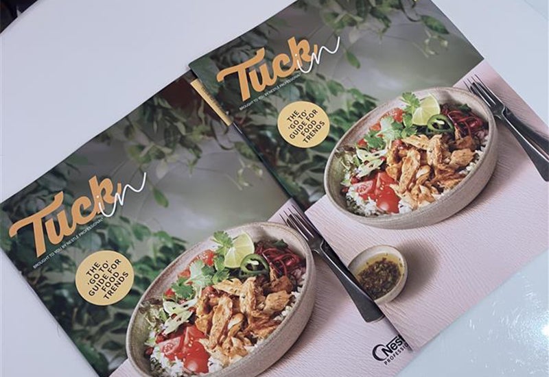 tuck in guides laid out on a table