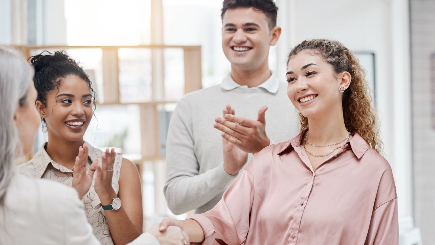 manager greeting employees