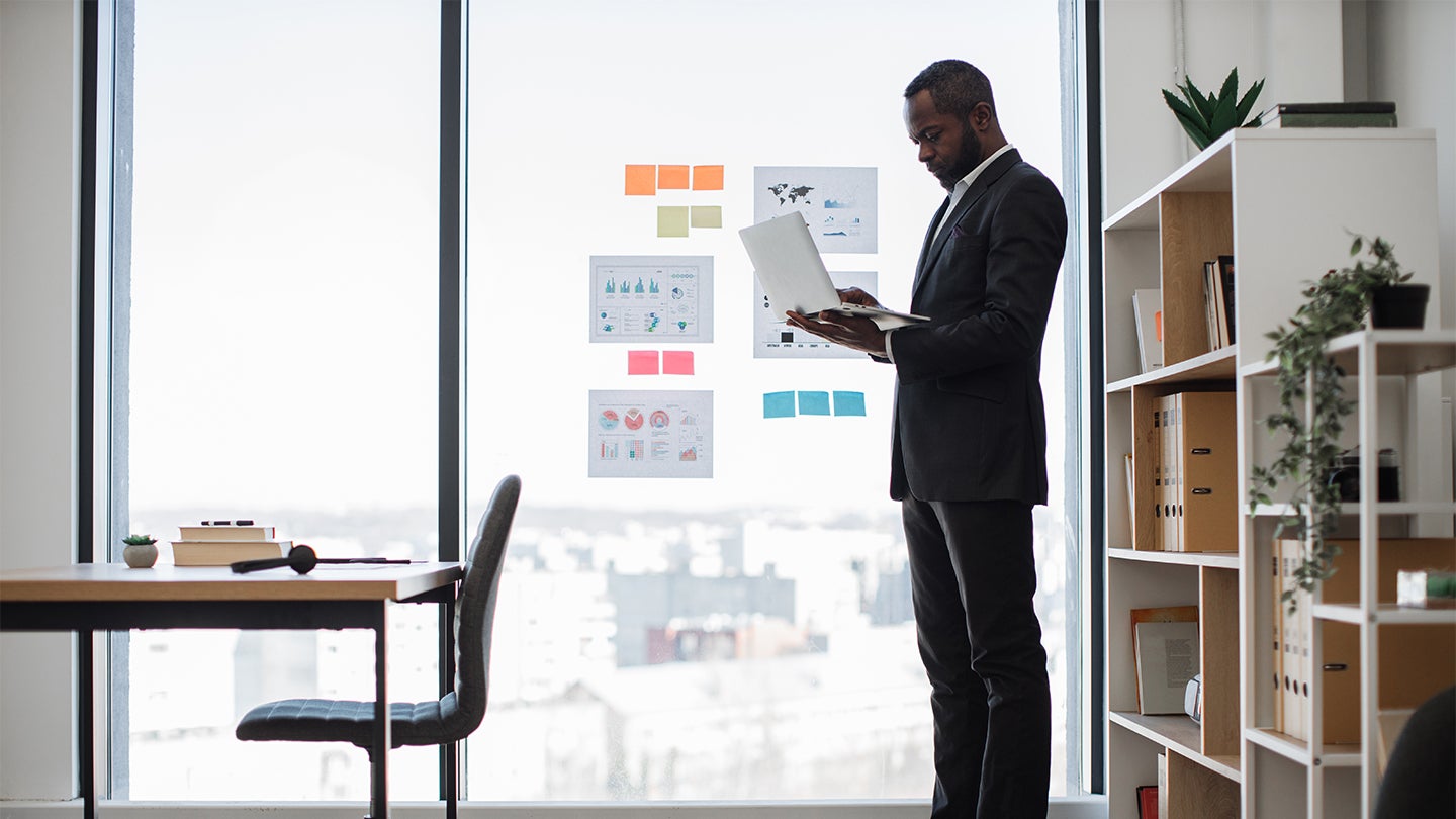 manager looking at laptop