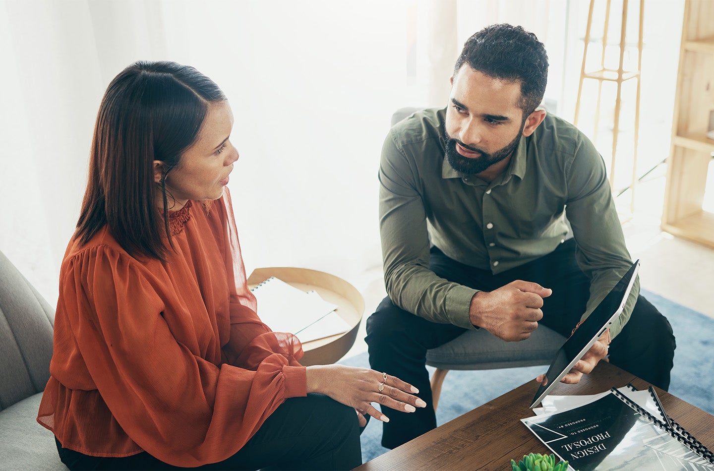 employees discussing with an iPad
