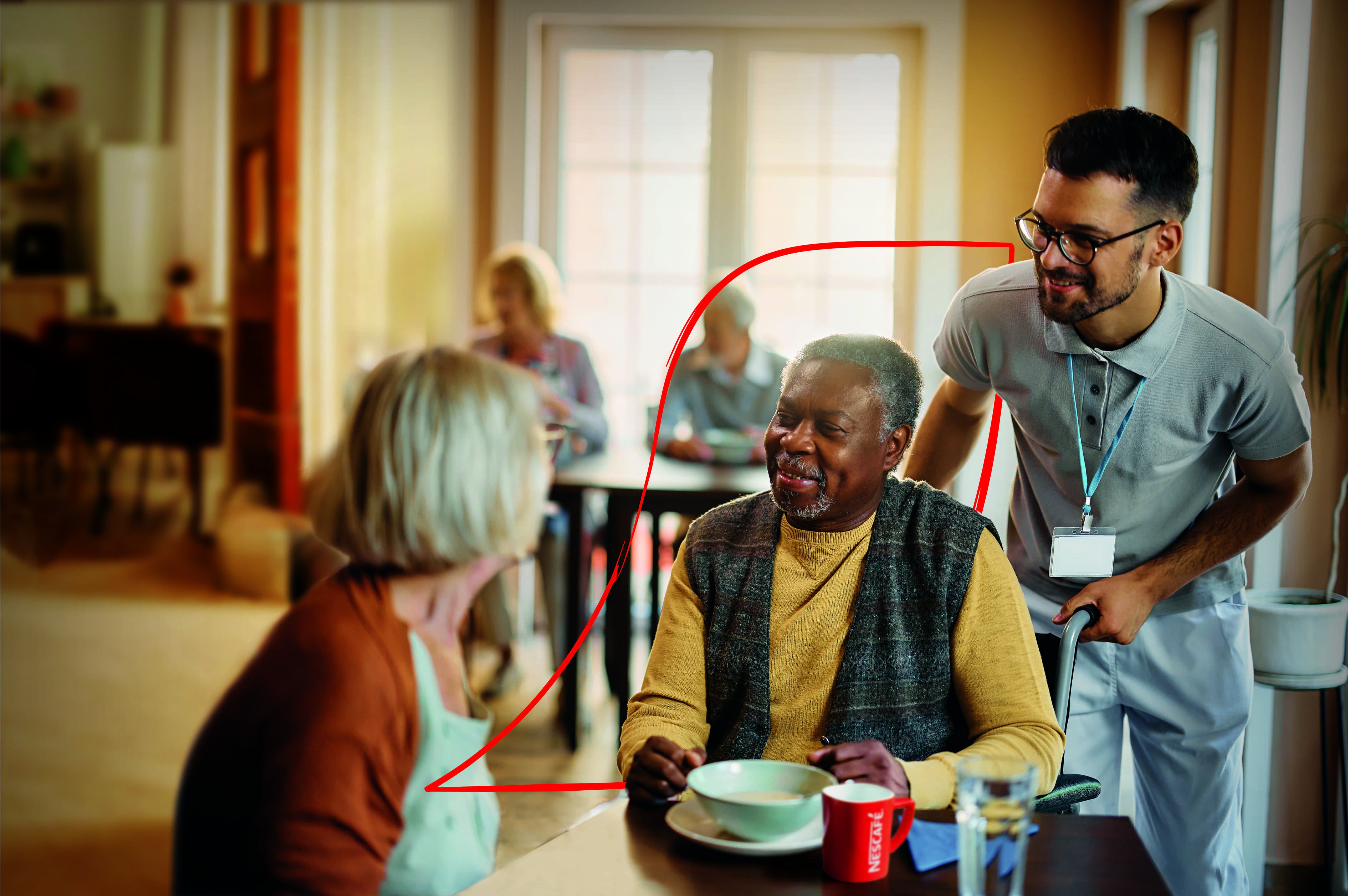 nescafe care home activity pack SS24 cover showing two care home resident, a man and a woman, talking with a staff member