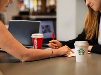 people drinking a NESCAFÉ® and Starbucks coffee