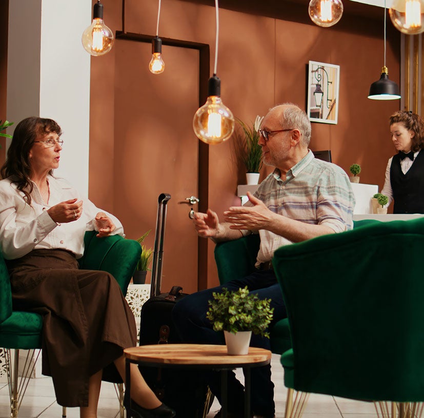 couple enjoying coffee in hotel lobby