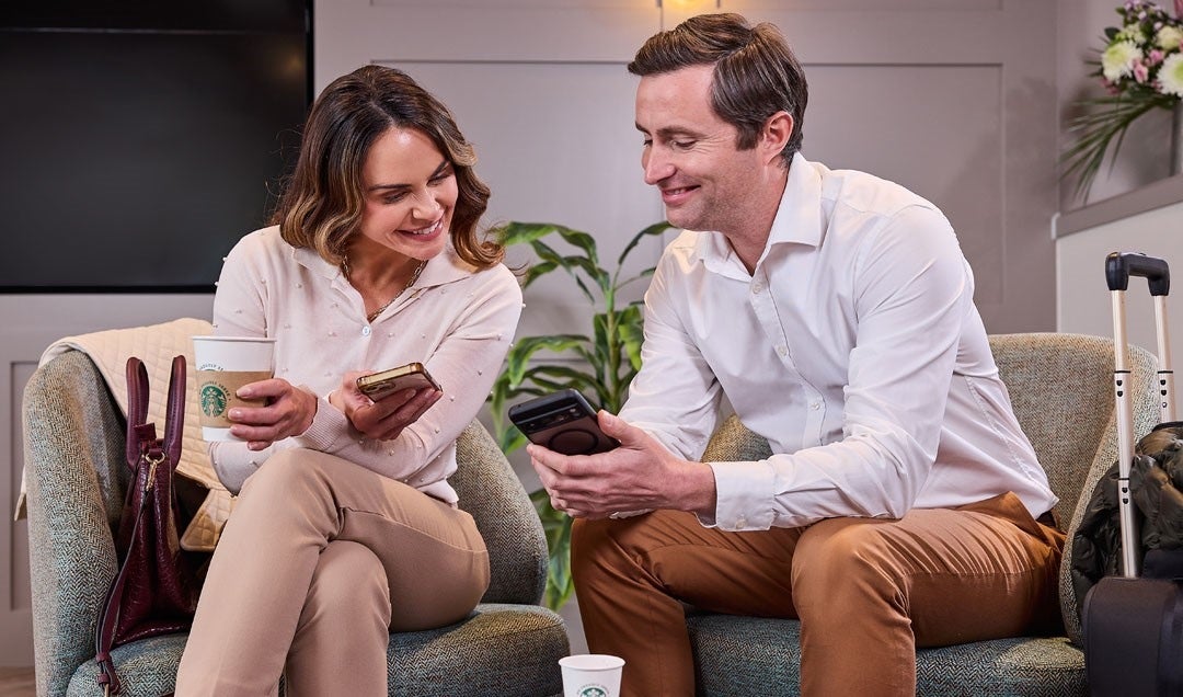 two guests enjoying coffee in hotel lobby