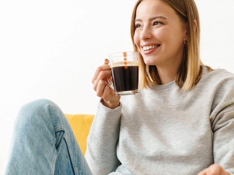 lady drinking nescafe azera