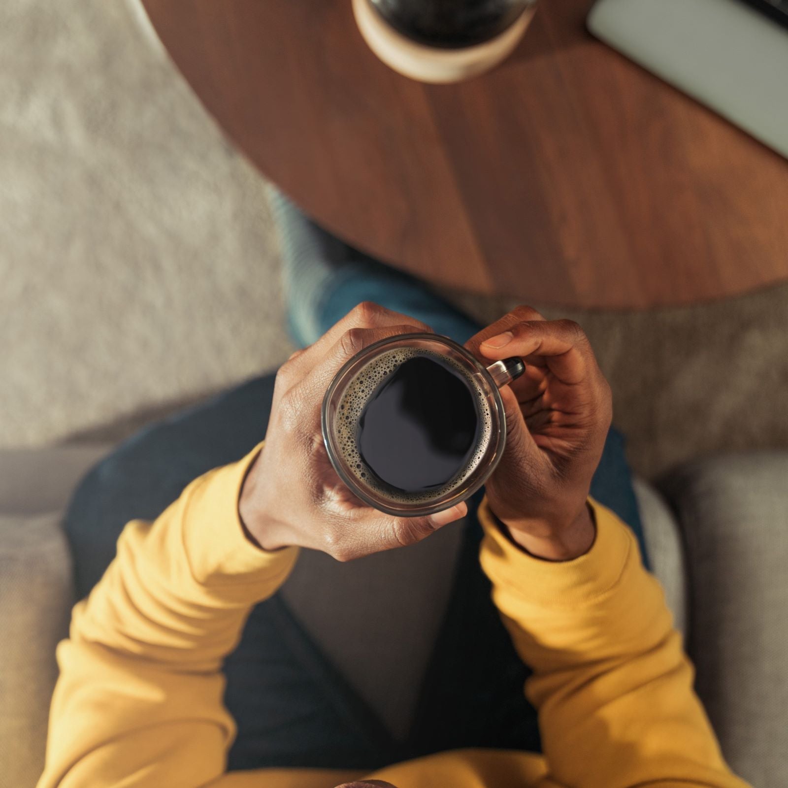 hands holding mug of coffee
