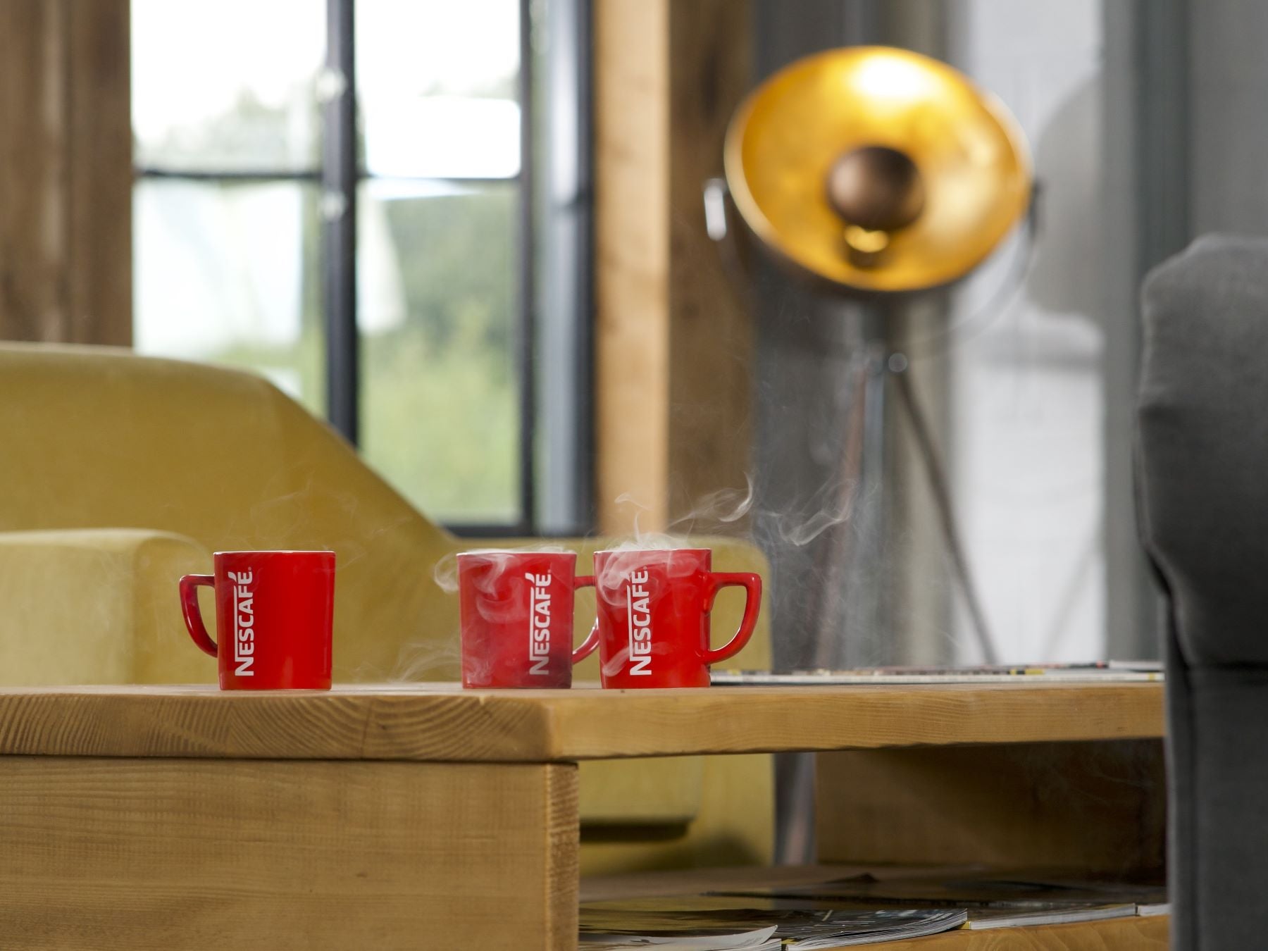 nescafe mugs on table