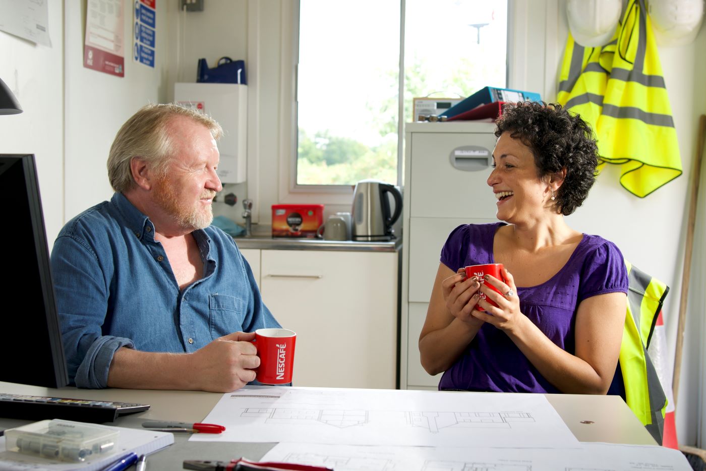 two people enjoying nescafe original in the workplace