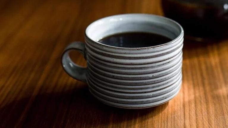 A freshly brewed cup of coffee on a table