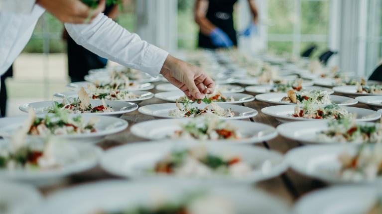 A chef plating food