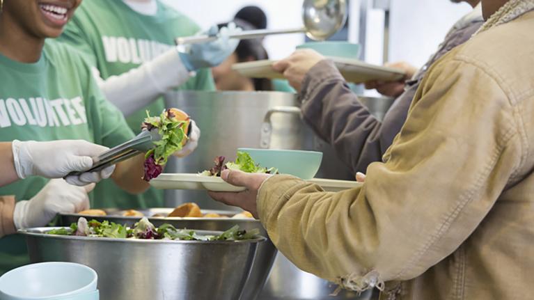 volunteers serving food