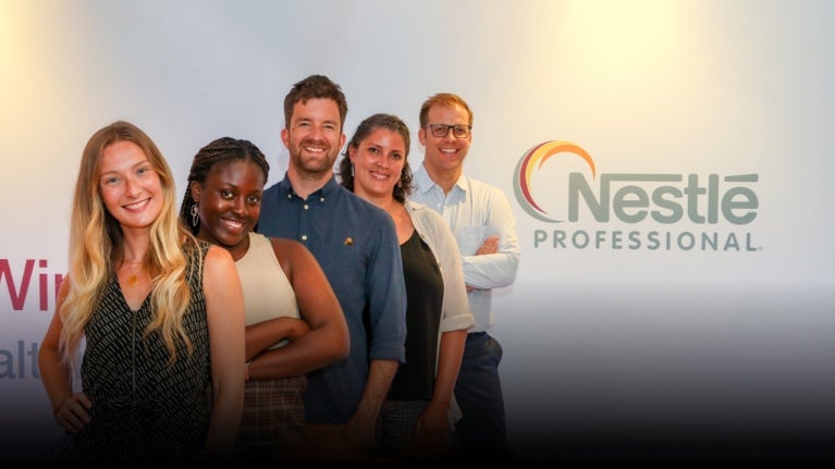 5 people standing together with the Nestle Professional logo
