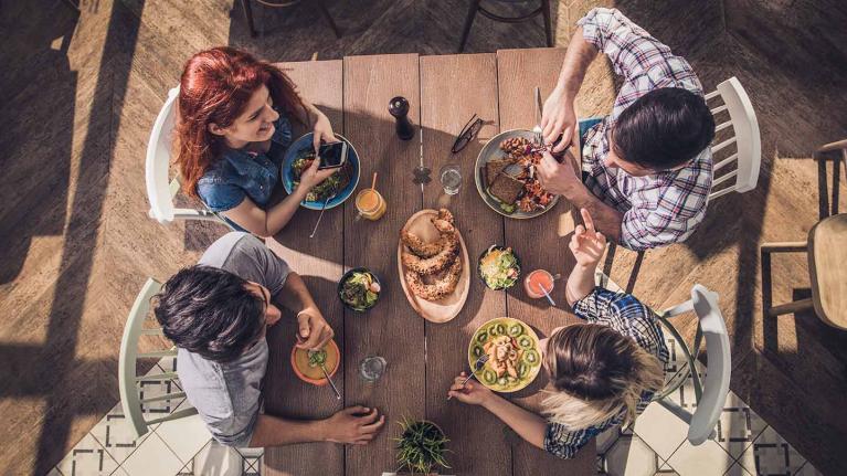 a view from above of friends having a meal