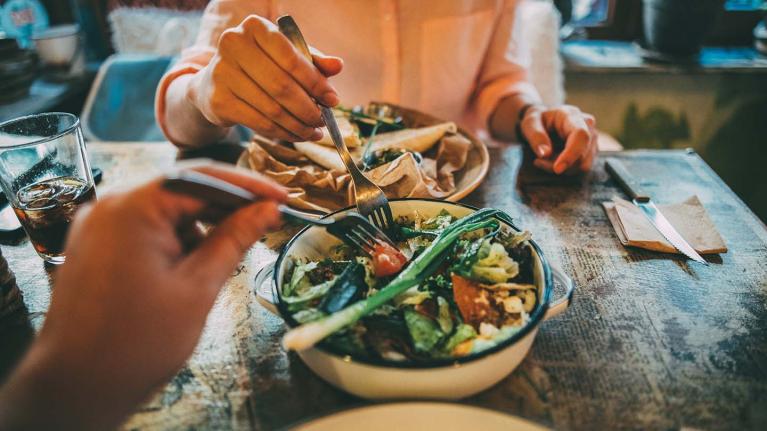 Two people enjoying a plant based meal