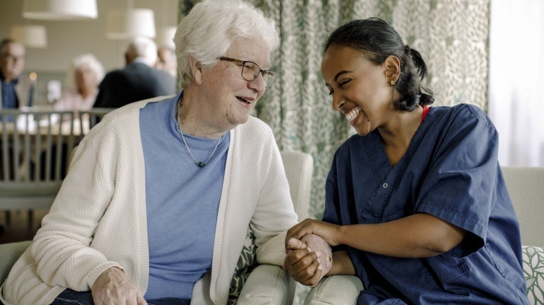 carehome-resident-and-worker-having-a-chat
