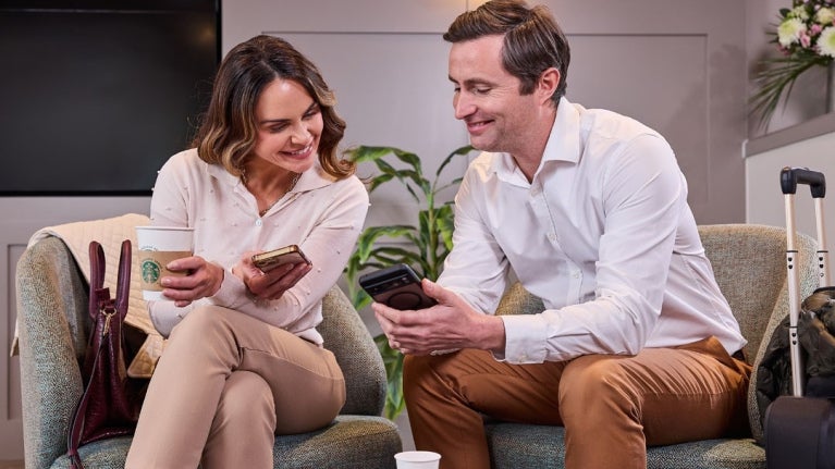 two guests enjoying coffee in hotel lobby