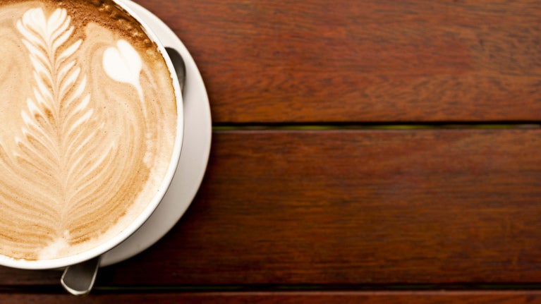 overhead shot of cappuccino in a mug