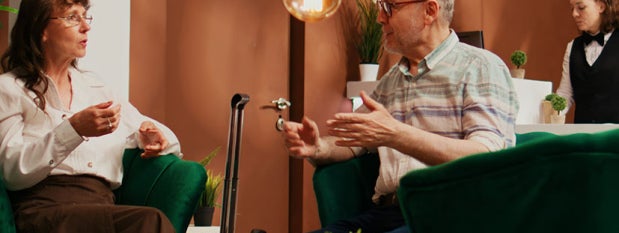 couple enjoying coffee in hotel lobby