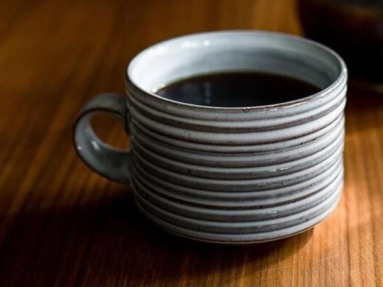 A freshly brewed cup of coffee on a table