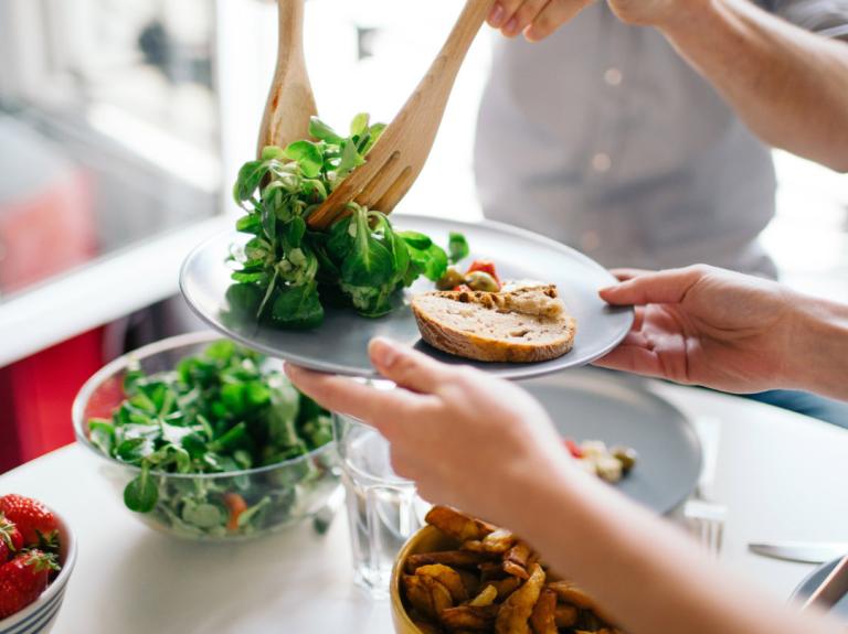 A person plating food
