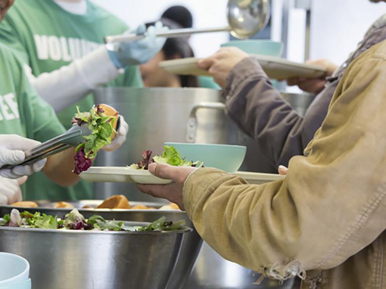 volunteers serving food