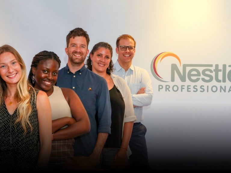 5 people standing together with the Nestle Professional logo