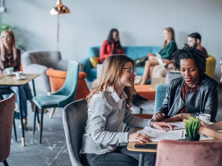 A group having a conversation in a cafe