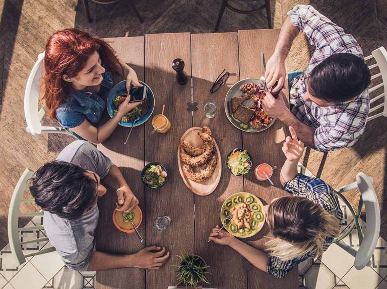 a view from above of friends having a meal
